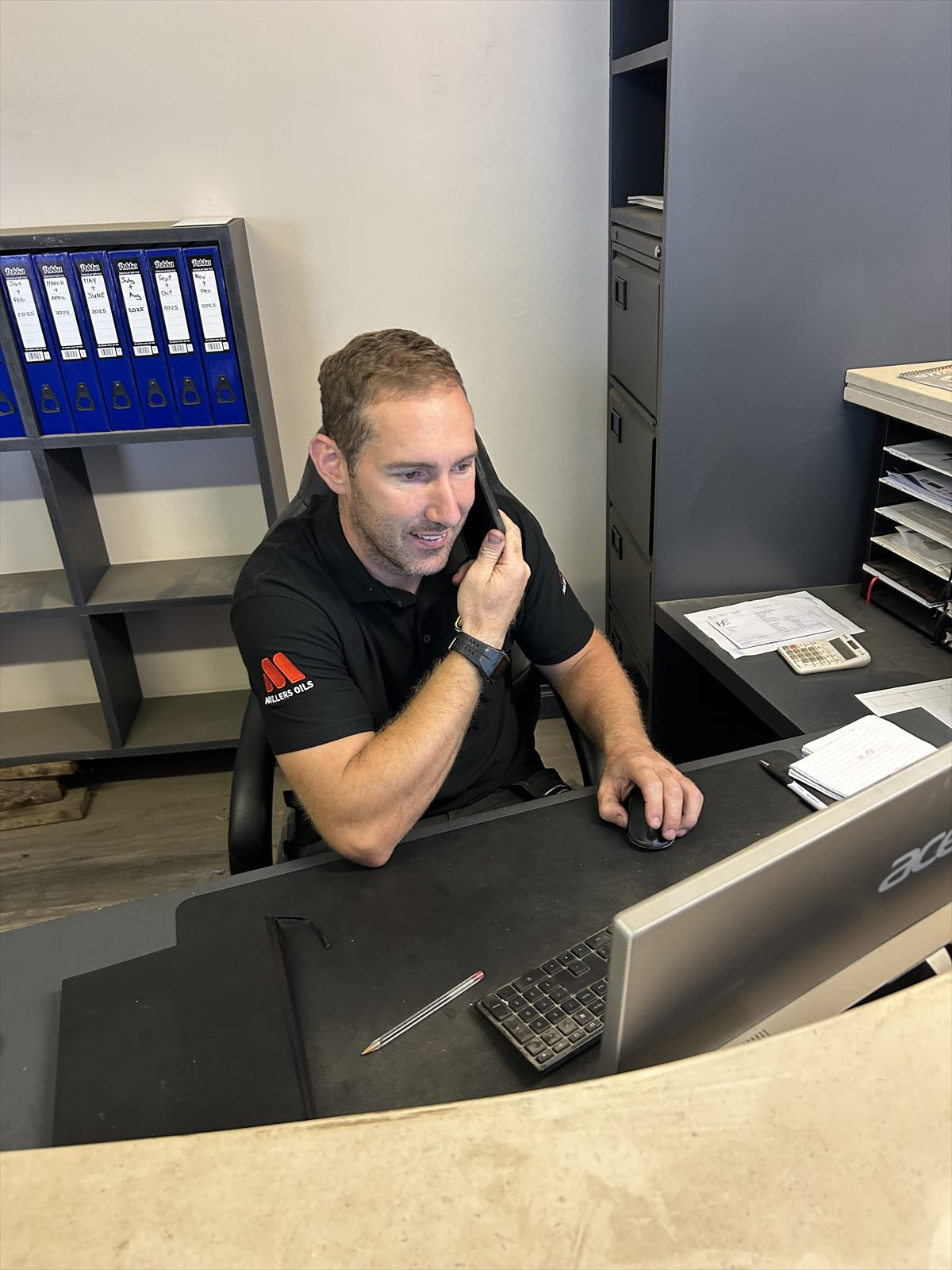 Tom Stafford taking a customer call at Liquid Technology