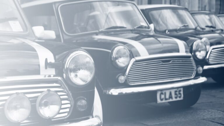 A row of classic Minis parked on a city street